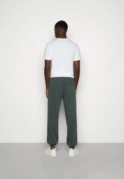 YOURTURN Oversized Unisex - Trainingsbroek -Dark Green -Yourturn Verkoopwinkel 42776076c49c4d49984fa3254d41719b