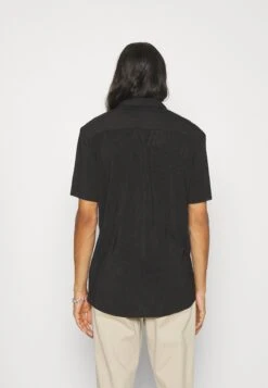 YOURTURN Plisse Shirt Unisex - Overhemd - Black -Yourturn Verkoopwinkel f669a991e42c4ea187536b79575d26d9